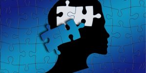 Illustrasjon av et hode og puslebrikker